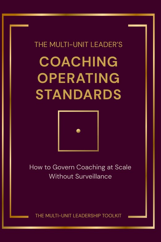 Book cover: Coaching Operating Standards by Jason E. Brooks, deep maroon cover with a gold frame and gold title.